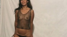 Mikayla wears a fishnet top and bikini bottoms that she takes off