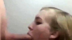 Blonde college girl gives a blowjob on her knees